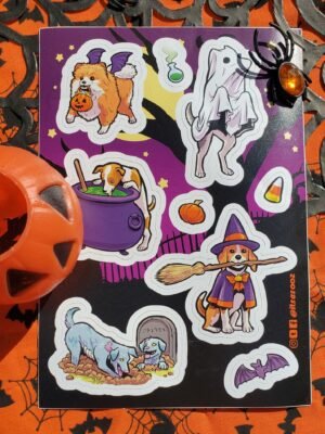 Image of the Dog Halloween sticker sheet, featuring a bat-winged Pomeranian, a dog dressed as a ghost, a dog drinking from a cauldron of witches' brew, a beagle dressed as a witch and carrying a broom in its mouth, and a zombie dog digging up another zombie dog from a grave